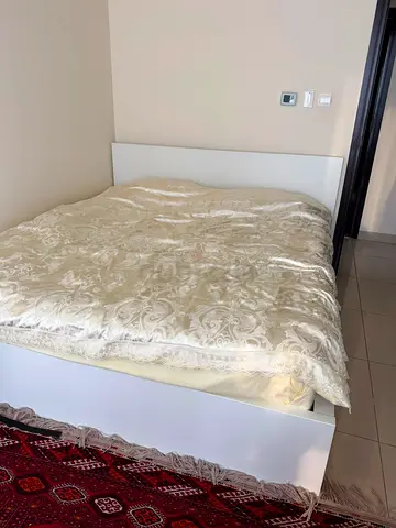 White double bed frame with headboard and under storage - good condition