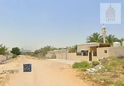 Two townhouse plots for sale in Al Helio 2, Ajman. Freehold ownership, fees included. Prime location.