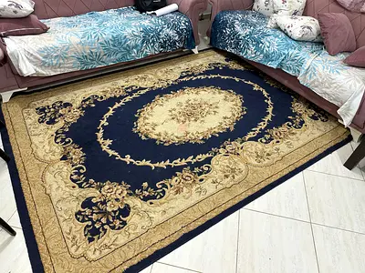 Classic navy and beige floral area rug - good conditioning