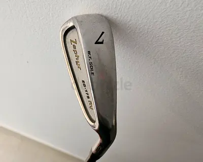 Used 7 iron with white grip