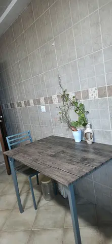 Dining table with four chairs - solid top, excellent condition.