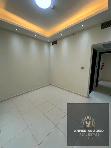 One-bedroom apartment with a living room and two bathrooms for annual rent in Emirates City Towers on Mohammed Bin Zayed Road. Excellent location, clo