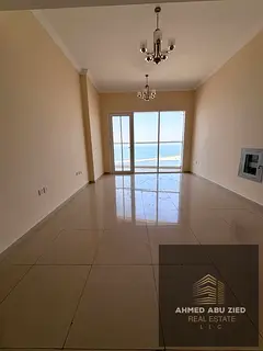 A distinctive apartment for annual rent in Ajman, 2BR, master BR, free AC, sea view, large area, spe