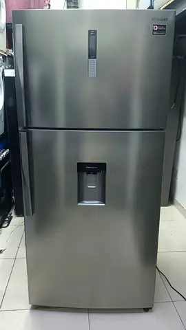 Silver top-freezer refrigerator with water dispenser - Good condition