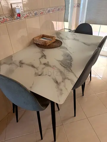 Marble-effect dining table with 4 grey upholstered chairs