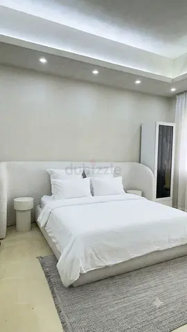 Minimalist King Bed with Curved Upholstered Headboard - White/Beige with side tables