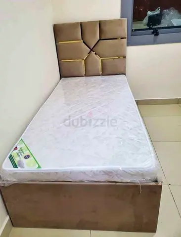 Single bed with upholstered headboard and new mattress (ready to use)