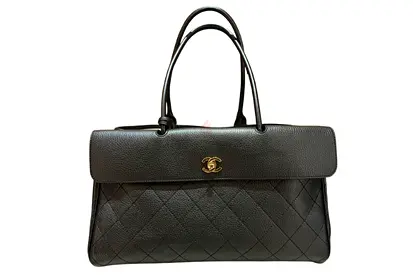 CHANEL Small Tote crafted from black grained calfskin leather featuring diamond quilting and gold-to