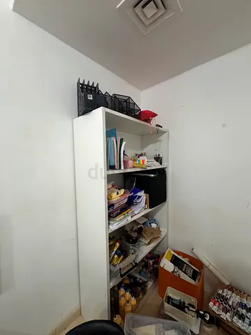 White tall storage cabinet with open shelves - good condition