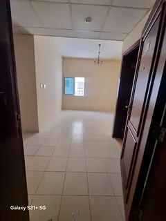 For rent in Al Qasimia Al Nad, Sharjah: 2-bedroom apartment, 2 bathrooms, kitchen, central AC, centr