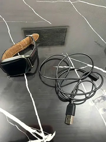 Used smartwatch with USB charging cable - working condition. 2015 asus model.it got playstore