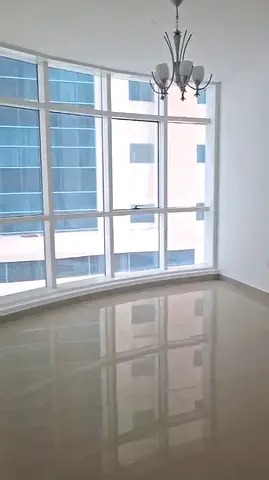 Two bedrooms and a living room for annual rent in Al Taa'won, right by the Dubai exit, for 43,000 with a parking space, 6 installments,