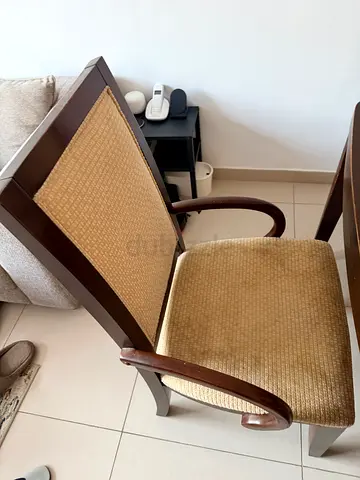 Wooden armchair with beige seat