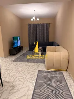 Luxury two-bedroom apartment with a living room and open balcony. Ajman, Al Rashidiya 3. Fully furni