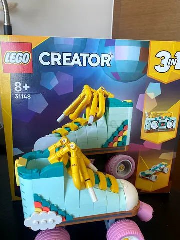 Small pastel toy roller skate car with detachable horn and flower details