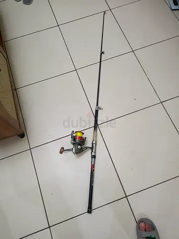 Used telescopic fishing rod with spinning reel - ready to fish