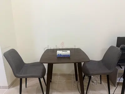Compact Wooden Dining Table with Two Grey Fabric Chairs