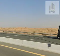 Commercial land for sale in Al Bataeh, Sharjah. Freehold ownership for all nationalities. Strategic