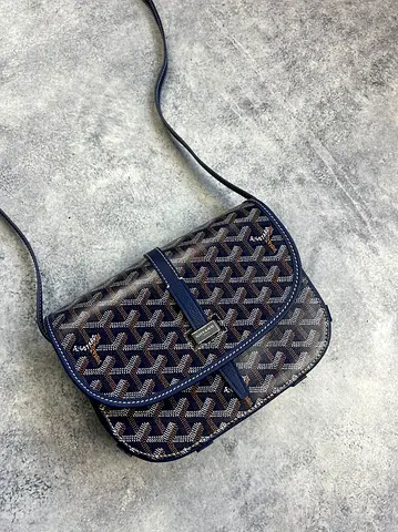 Goyard Belvedere II PM messenger bag made from black coated canvas with tan leather trim.