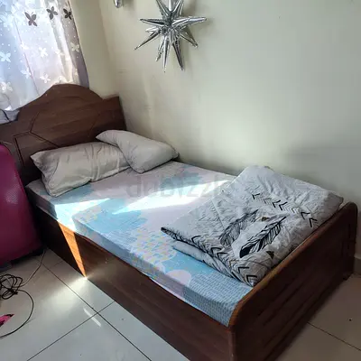 Single wooden bed frame with mattress — good condition