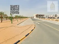 Residential and commercial corner land in Al Bahia