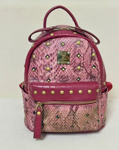 MCM Small pink studded leather backpack -
