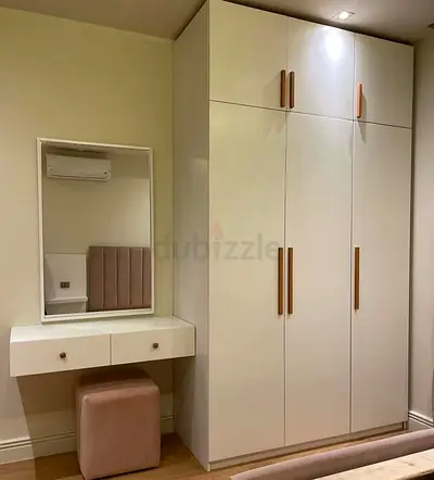 White built-in wardrobe with vanity and stool - modern bedroom set