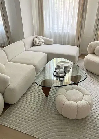 Cream boucle modular sofa set with matching pouf and chaise