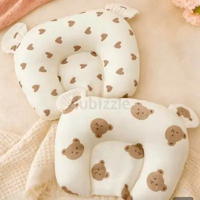 Pair of newborn head support pillows — cute bear heart prints, like new