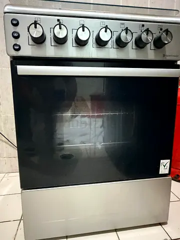 Used freestanding stainless steel oven with gas burners - good working condition