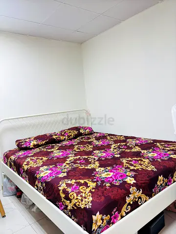 White Metal Double Bed Frame with Floral Mattress Cover