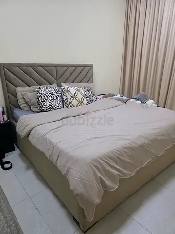 King upholstered bed frame with padded headboard, good condition