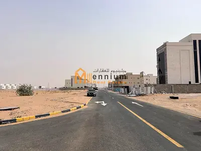 For sale in Rawdat Al-Qurt: a residential plot in a prime location on a 54-meter-wide street, ready for construction.