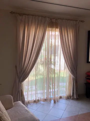 TWO  BEIGE CURTAINS/NETS PLUS ANTIQUE RAILS NOW 299