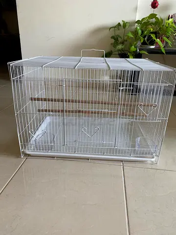 White metal bird cage with perches — good condition, never used