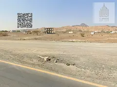 Residential land with street and alley access in Masfout 11 area,