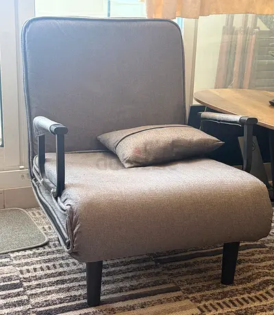 Compact grey fabric armchair with cushion - good condition