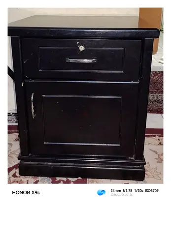 Used black wooden bedside cabinet with drawer and cupboard