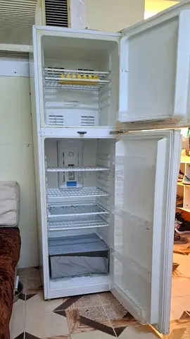 Used white double-door refrigerator - functional