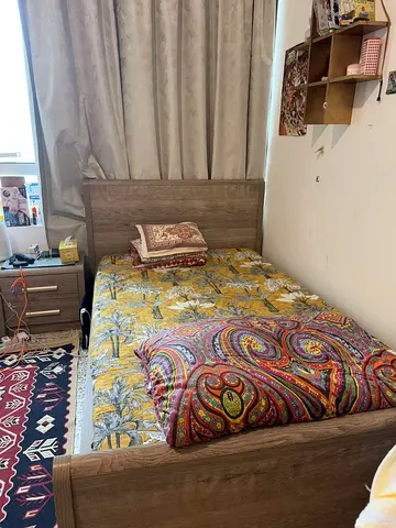 Single wooden bed frame with mattress included - good condition size 120 by 200