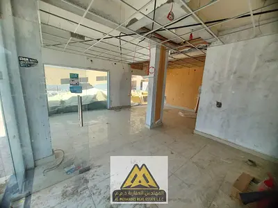 Two adjacent shops that can be combined in Al Nuaimiya 1, a vibrant area suitable for any commercial activity.