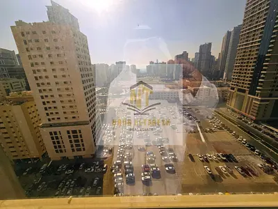 Apartment for sale in Sharjah – Al Khan: two master bedrooms, a living room, and a guest bathroom; area: 1,100 sq. ft.; includes parking; service char