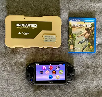 PS VITA OLED 3G/WiFi + RARE THRUSTMASTER UNCHARTED CASE + UNCHARTED GAME + 8GB SONY MEMORY CARD.