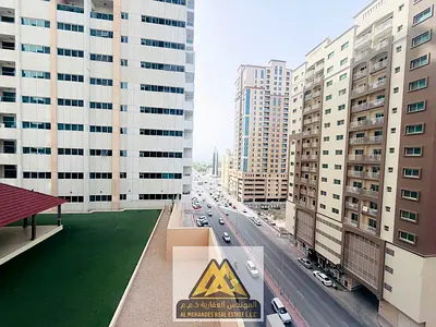 A spacious one-bedroom apartment with a balcony and open views in Ajman Towers, Al Rashidiya 3, near all services and close to the Corniche.