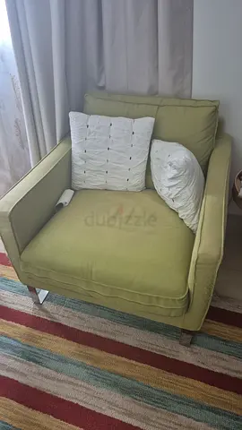 Light green single armchair with cushion - good condition