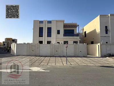 Villa for sale in Ajman, Al Helio area, including registration. It consists of 5 master bedrooms, a majlis, a living room, and a maid's room. Freehold