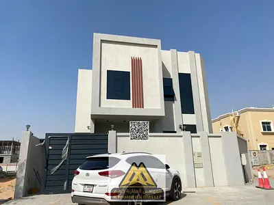 A luxurious family villa with super deluxe finishes, covered indoor parking, a lavish majlis, and a prime location behind the park in one of Ajman's