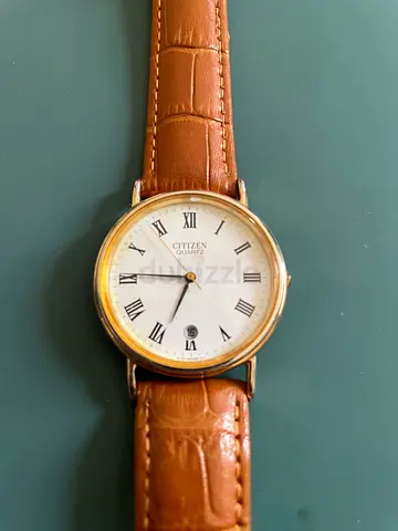 Citizen Quartz mens watch with brown leather strap, classic Roman dial