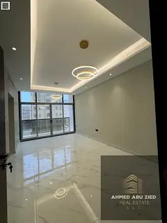 2BR annual rental in Ajman, large rooms, spacious hall, central AC, modern finishes, elegant decor,
