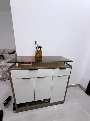 Compact modern storage cabinet with drawers and doors